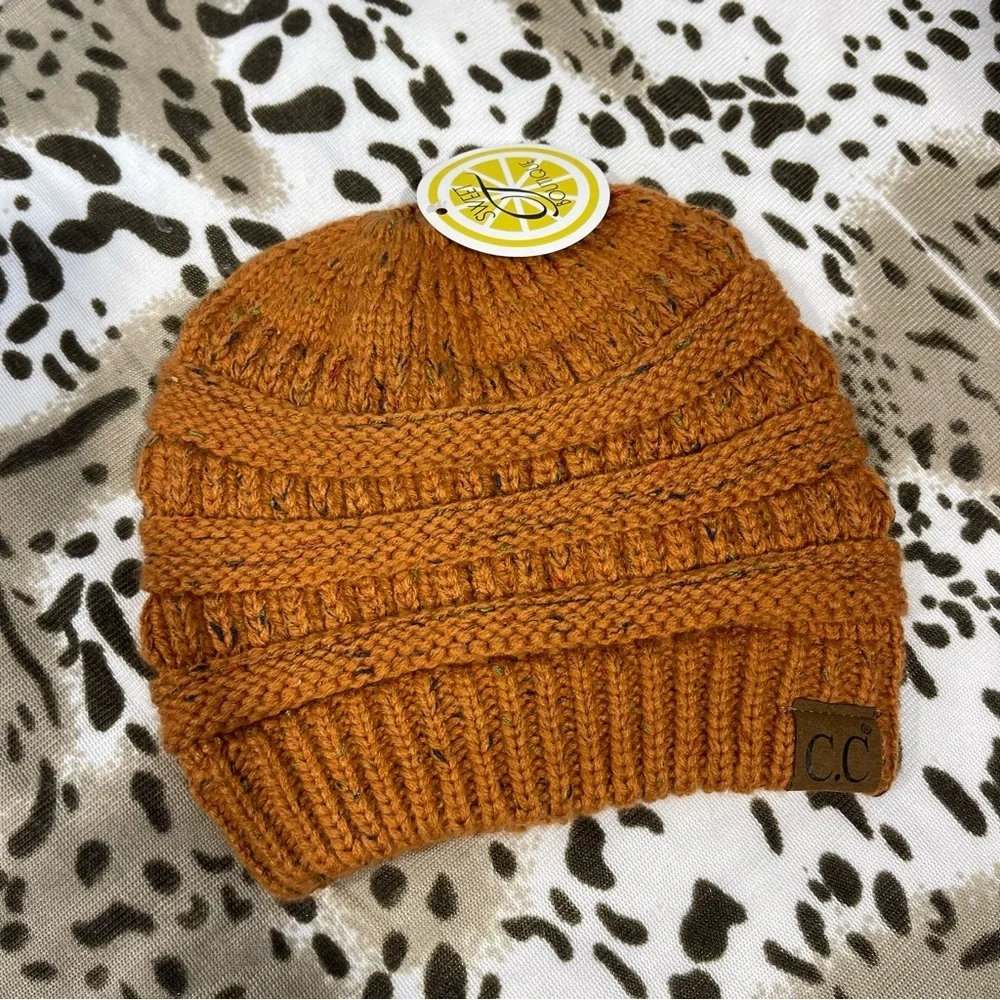 CC Boutique Warm Knit Hat in Rust Orange messy bun top